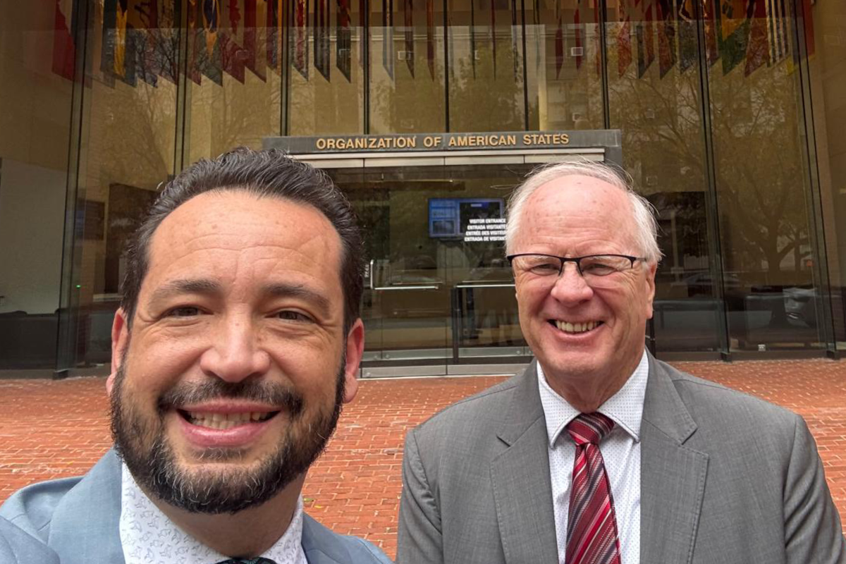 Daniel Pole (right) in front of the Inter American Commission on Human rights in Washington.